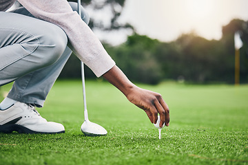 Image showing Ready, golf ball and tee with hand of black man on field for training, tournament and challenge. Start, competition match and sports with athlete and club on course for action, games and hobby