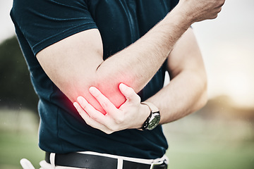 Image showing Sports, elbow pain and man on golf course holding arm during game massage and relief in health and wellness. Green, zoom on hands on muscle for support and golfer with ache during golfing workout.