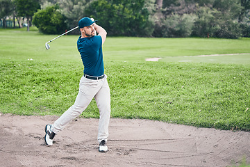 Image showing Golf stroke, sport and golfer outdoor for game, fitness and exercise on grass with a swing. Athlete, training and man at a sports club for cardio and workout on a green course with focus and action