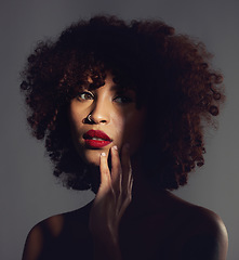 Image showing Shadow, red lipstick and makeup on woman with beauty or natural hair in studio. Face of aesthetic female model with a skin glow, shine and color on lips for art, power and facial skincare