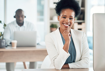 Image showing Happy, success and portrait of a businesswoman in the office with a computer working on a project. Happiness, smile and African female corporate manager sitting at her desk with a pc in workplace.