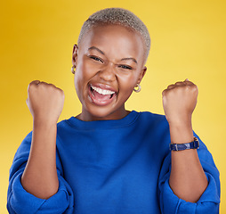 Image showing Portrait, happy black woman and fist of winner in studio for celebration, achievement deal and success. Excited female model celebrate winning prize on background for lottery, bonus victory and smile