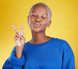 Image showing Happy, success and black woman with peace sign, support and cheerful against a studio background. African American female, lady and v hand gesture with smile, happiness and facial expression with joy