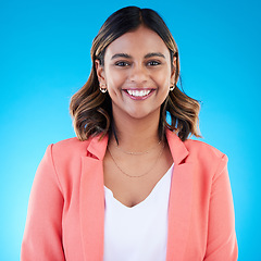 Image showing Smile, portrait and business woman in studio isolated on a blue background with pride for career, profession or job. Face, professional and confident, happy and proud female entrepreneur from India.