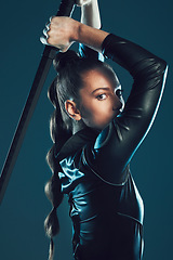 Image showing Woman, warrior and vigilante in cosplay with sword ready for battle, war or game against a dark studio background. Portrait of female in black hero costume with blade for halloween or superhero