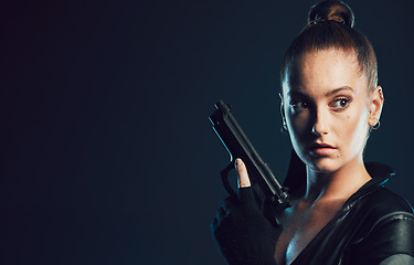 Image showing Woman, vigilante and gun in serious war, battle or agent standing ready for mission on mockup. Female spy holding weapon for secret operation, objective or cosplay against a dark studio background