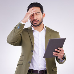 Image showing Business man, headache and tablet in a studio feeling frustrated from stress and anxiety. Employee burnout, depression and digital tech issue with isolated white background and 404 web problem