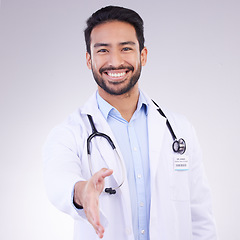 Image showing Doctor, man and handshake for healthcare partnership, meeting or greeting against a white studio background. Portrait of happy male medical professional shaking hands for introduction or thank you