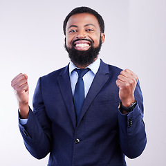 Image showing Yes, winner portrait and business black man isolated on gray background celebration for opportunity, bonus or winning. Happy person, fist pump and celebrate corporate promotion or job news in studio