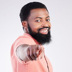 Image showing Point, smile and portrait of black man in studio with hand gesture for motivation, encouragement and selection. Happy, mockup and male on white background pointing for choice, advertising or decision