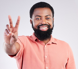 Image showing Black man, hand and peace sign in studio portrait with smile, emoji or happiness by background. Young african model, signal or zen symbol for opinion, mindset or voice for confident pride by backdrop