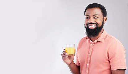 Image showing Orange juice, studio portrait and happy black man with drink glass for hydration, liquid detox or weight loss beverage. Vitamin C benefits, male nutritionist diet or person on mockup gray background