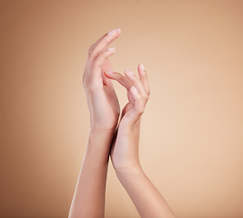 Image showing Hands, manicure and natural nails beauty of female model with cosmetic care, skincare or self care isolated in brown studio background. Beauty salon, palm and polish for bodycare and healthy skin