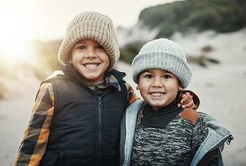 Image showing Portrait, children and brothers on the beach together during summer on holiday or vacation in nature. Kids, sand and travel with a young boy friends bonding outdoor on the coast during the day