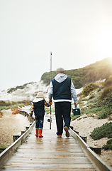 Image showing Fishing, child and grandfather walking on beach pier with tools from back, bonding time on weekend with mockup. Nature, family and old man with boy holding hands and learning catch fish in Greece.