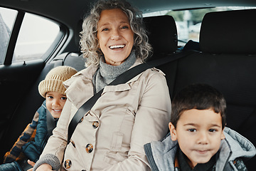 Image showing Portrait, road trip and grandmother travel with children or grandchildren and relax on a car ride in the backseat. Bonding, happy and grandma traveling with kids or grandkids on a journey