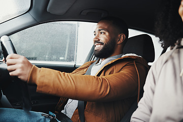 Image showing Man driving, rain and smile in city with car journey, winter travel and happiness for road trip. Guy driver, transportation and urban adventure with safety, vacation or holiday with excited face