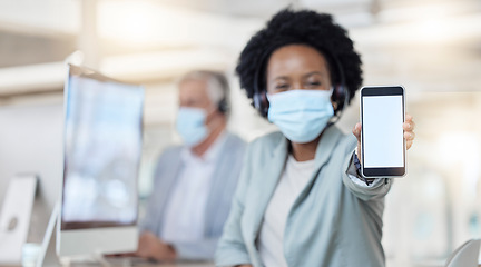 Image showing Call center, phone and woman face mask with mockup for covid compliance, safety and health mobile app. African telemarketing agent, consultant or person portrait and cellphone screen or mock up space