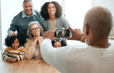 Image showing Love, smile or phone photography with happy family in living room for social media, bonding or relaxing. Happiness, pictures or generations with grandparents or children at home for memory or support