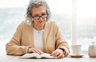 Image showing Old woman reading book, story or bible to relax in hobby or retirement for peace or learning religion. Elderly studying or calm senior person with novel for information or knowledge on table at home