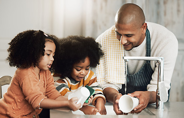 Image showing Happy, cleaning and father with children in kitchen for bonding, hygiene or teaching. Smile, support and chores with black family washing dishes at home for sanitary, responsibility or housekeeping