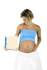 Image showing Pregnant woman holding a book