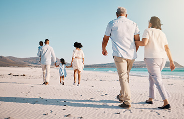 Image showing Holding hands, beach family and people walk, bond or enjoy time together for travel vacation, holiday peace or freedom. Sea water, ocean love and back view of senior couple in Rio de Janeiro Brazil