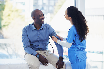 Image showing Black man, doctor and blood pressure healthcare in hospital for health insurance consultation. Patient and professional nurse woman talking about hypertension, wellness and advice for healthy life