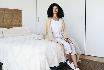 Image showing Black woman relax, bedroom and home interior of a young female sitting on a bed feeling relax. House, morning and person calm on a blanket and duvet on a mattress getting ready for a nap and day rest