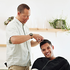 Image showing Father, man and shaving hair in home for grooming, cleaning and trimming. Smile, laughing and happy male or son getting haircut with electric shaver from senior dad for hairstyle and bonding in house