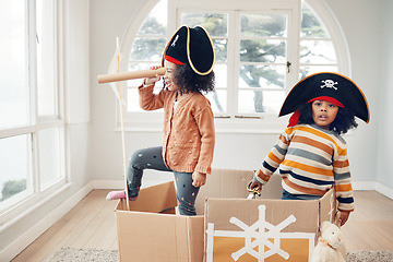 Image showing Pirate, box and games with children in living room for playful, creative and imagine. Fantasy, relax and party with kids sailing in cardboard boat at home for free time, weekend and entertainment