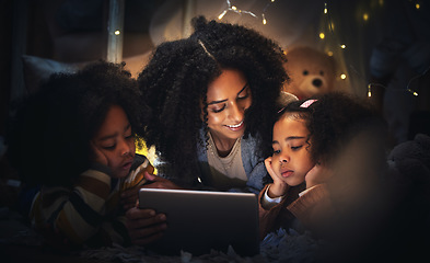 Image showing Tablet, night a mother reading to her children in a tent while camping in the bedroom of their home together. Black family, story or kids with a woman storytelling to her kids at bedtime for bonding