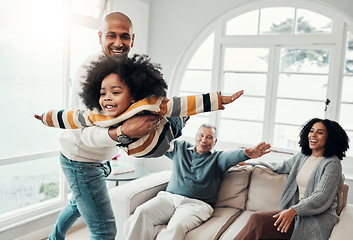 Image showing Airplane, playful and happy with family in living room for bonding, affectionate and support. Games, balance and weekend with father carrying child at home for free time, flying and laughing