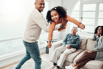 Image showing Dad, daughter and airplane game in living room for portrait, happy family or comic playing for bonding. Father, child and swing for plane games in lounge with woman, men or love for holiday happiness