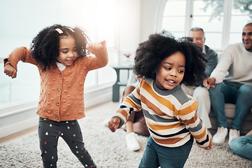 Image showing Children dancing, living room and happy family with parents, grandparents or love for comic smile in home. Kids, men and women for dance, care and happiness for brother, sister or together on holiday