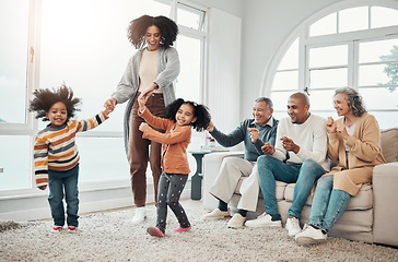 Image showing Black family, vacation and mother playing with children in a home in winter and bonding together in a house. Parents, grandparents and mom play with kid having fun in a living room on a getaway