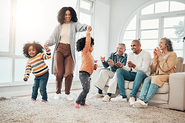 Image showing Happy family, playing and mother having fun with children in a home in winter and bonding together in a vacation house. Parents, grandparents and mom play with kid during a holiday getaway