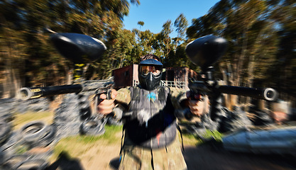 Image showing Man, paintball and dual wield gun for rapid fire, intense battle or war in the forest pushing to attack. Active army soldier holding guns for fast firing in extreme adrenaline sport competition