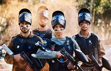 Image showing Team, paintball and portrait of army ready for battle, war or intense combat in extreme adrenaline sports. Group of people standing with guns in teamwork preparation for mission or sport match