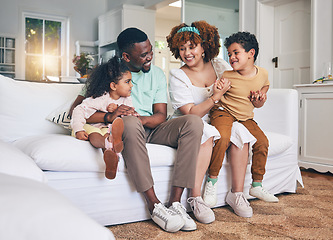 Image showing Black family, lounge and living room sofa of a mother, father and children with happiness. Happy, smile and bonding of a mom, dad and young kids together having fun with parent love and support