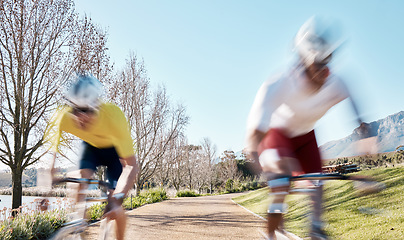 Image showing Race, cycling and speed with men in park for training, motion blur and cardio workout. Marathon, sports and exercise with cyclists riding on bike for fast, challenge and fitness for competition