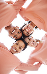 Image showing Happy, diversity and portrait of females in circle from bottom with partnership, unity and community. Happiness, smile and women friends laughing, bonding and standing together by a white background.