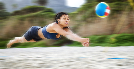 Image showing Beach volleyball, diving or sports girl playing a game in training or fitness workout in summer. Air jump, blurry dive action or active woman on sand in a fun competitive match in Sao Paulo, Brazil