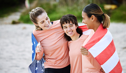 Image showing Friends, flag and usa with girls on the beach together during summer day for bonding in nature. Team, patriot and diversity with american people outdoor on the sand by the coast for a vacation