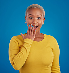 Image showing Shocked, surprise and portrait of black woman in studio for good news, announcement and wow. Secret, rumor and gossip with female isolated on blue background for amazing, satisfaction and deal