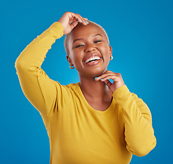 Image showing Happy, portrait and black woman in studio smile, cheerful and laughing on mockup, space or blue background. Face, joy and female laugh, joke and silly humor, carefree and having fun while isolated