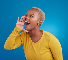 Image showing Shouting, announcement and loud with a black woman on a blue background in studio for news or communication. Hand, screaming and message with an attractive young female yelling to alert danger