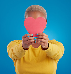 Image showing Paper, heart and cover with black woman in studio for love, date and kindness. Invitation, romance and feelings with female and shape isolated on blue background for emotion, support and affectionate