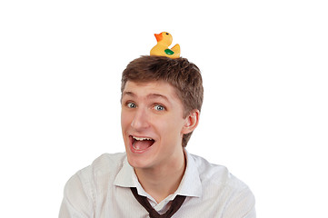 Image showing Young man with a rubber duck on his head