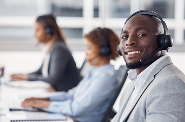 Image showing Portrait, telemarketing and black man with team, call center and customer service in workplace. Face, African American male employee or happy consultant in office, headset and tech support in office